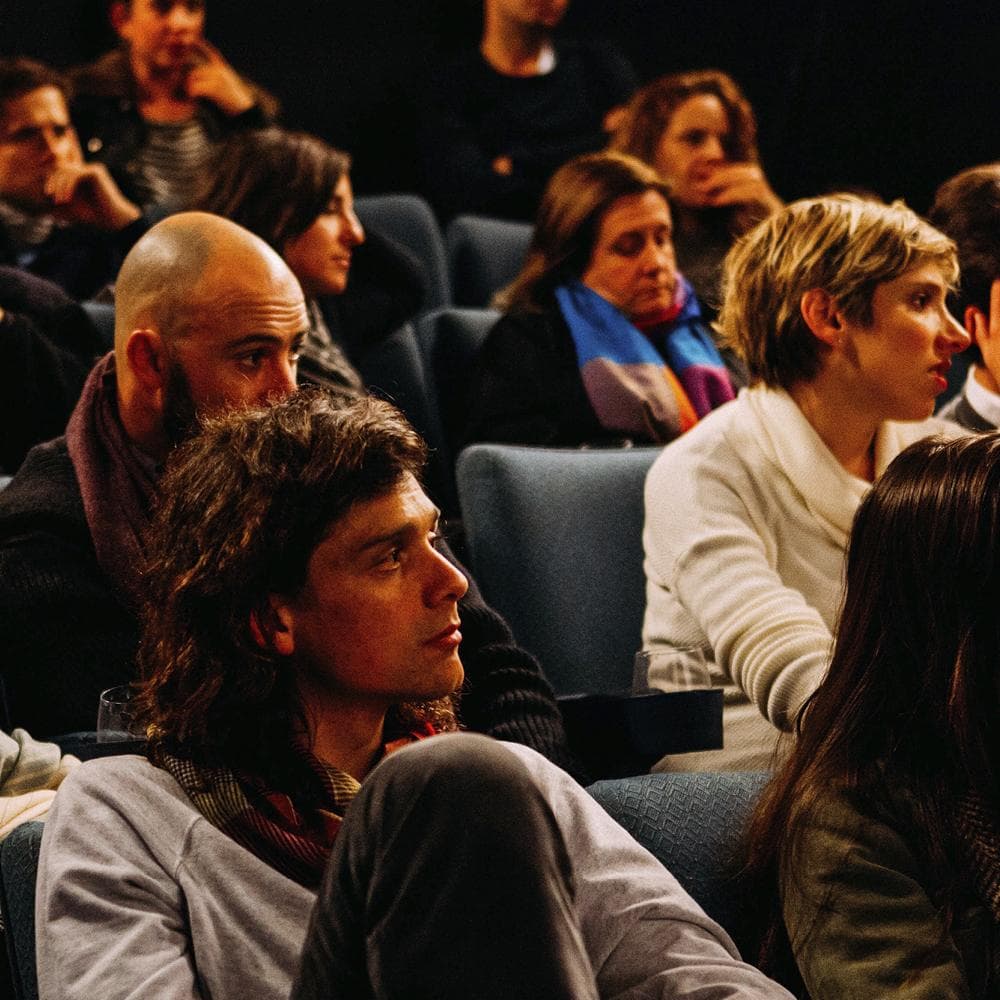 People sitting in a conference audience
